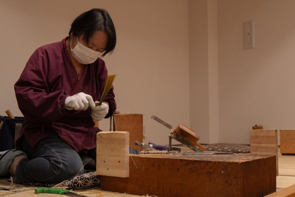 Craftsman at work to make traditional fan from Marugame