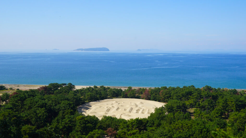 Amazing view of the sea and the famous Zenigata sand sculpture when cycling the Kagawa coastline